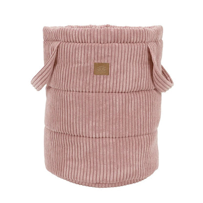 Empty powder pink corduroy toy storage basket with rope handles and ribbed texture