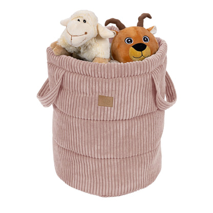 Powder pink corduroy storage basket filled with stuffed toys and holding handles