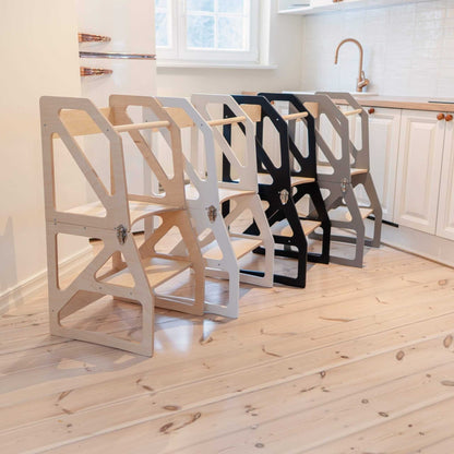 Multiple kitchen tower colors displayed in natural wood, white, and black finishes