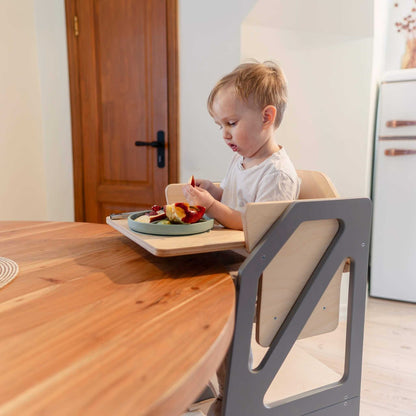 Black Modustep kitchen tower with wooden platform seat at dining level