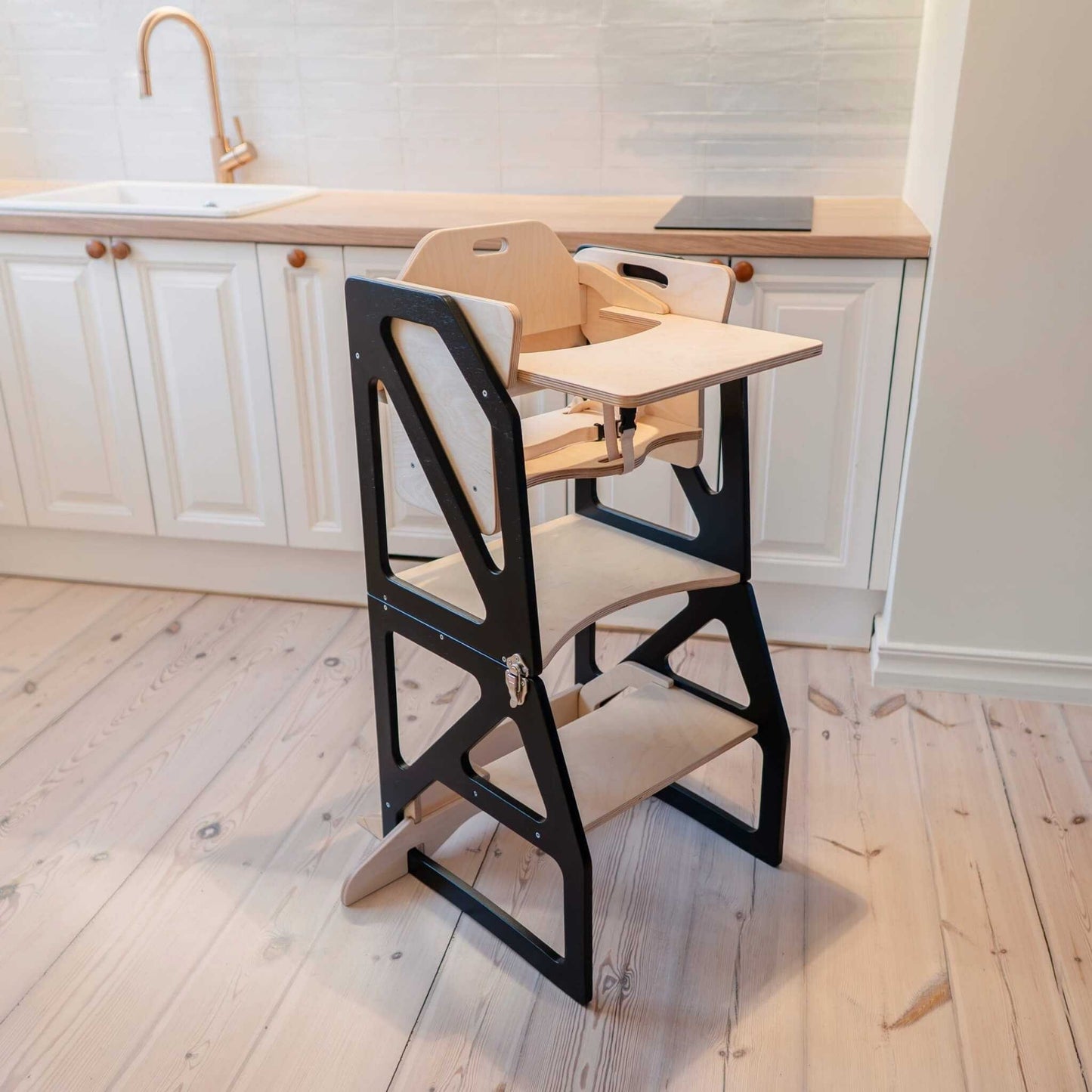 Natural wood kitchen tower positioned at adult countertop height