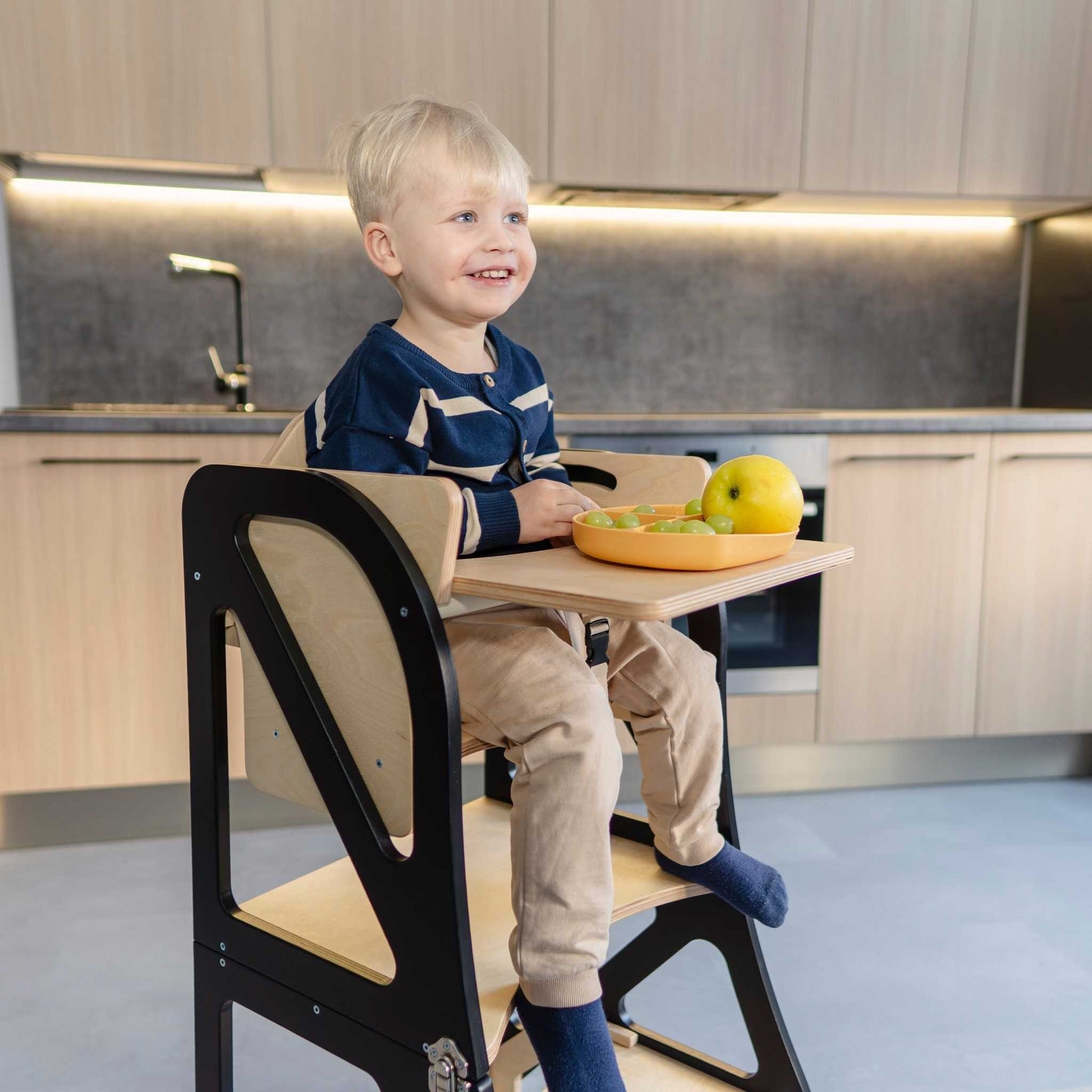 Cream high chair configuration with open frame design, side view display
