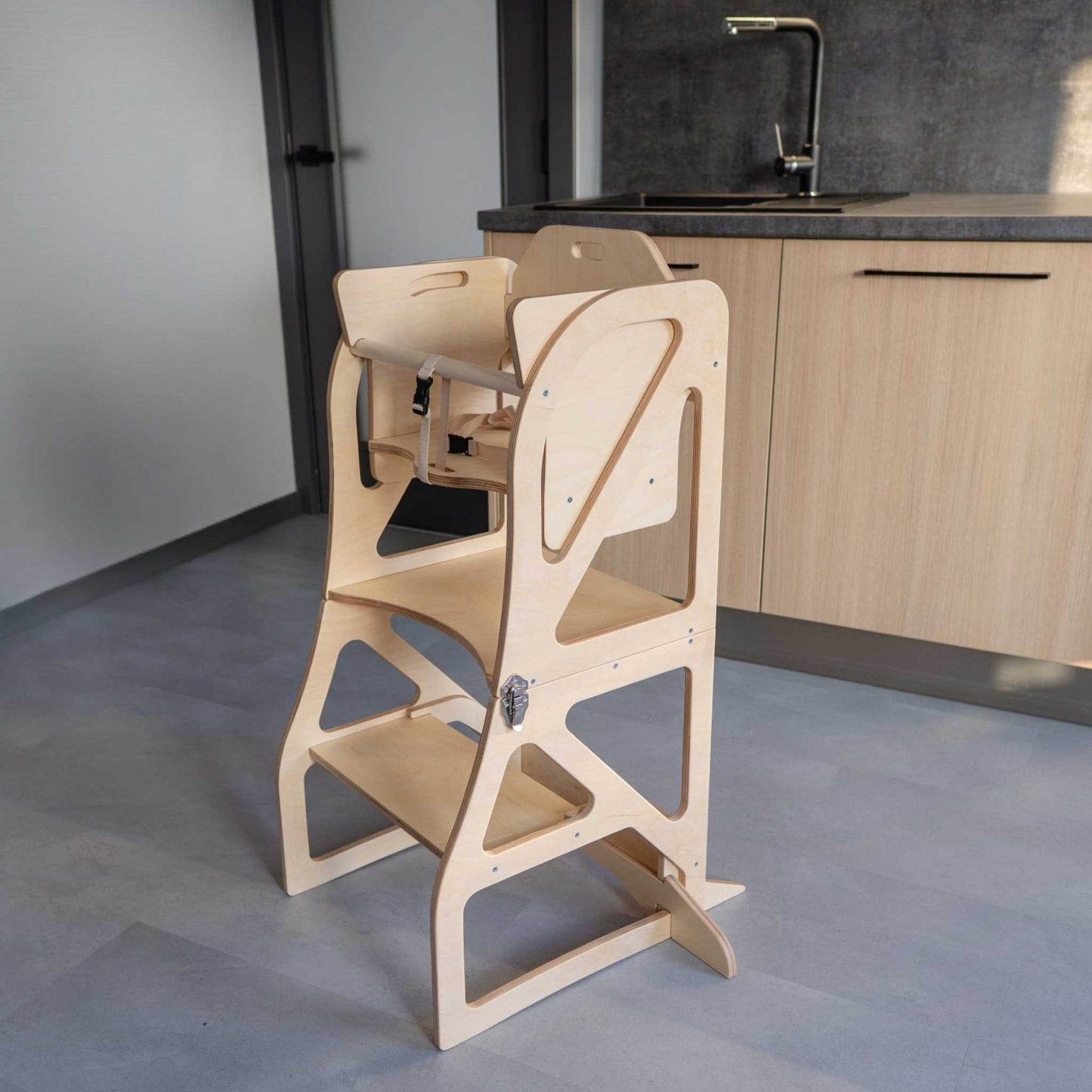 Natural wood kitchen tower with attached table, flat pack shown assembled