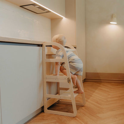 Front view of natural wood kitchen tower showing rounded frame design