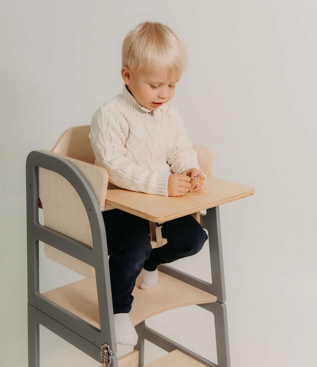 Child using natural kitchen tower for safe counter-height kitchen access