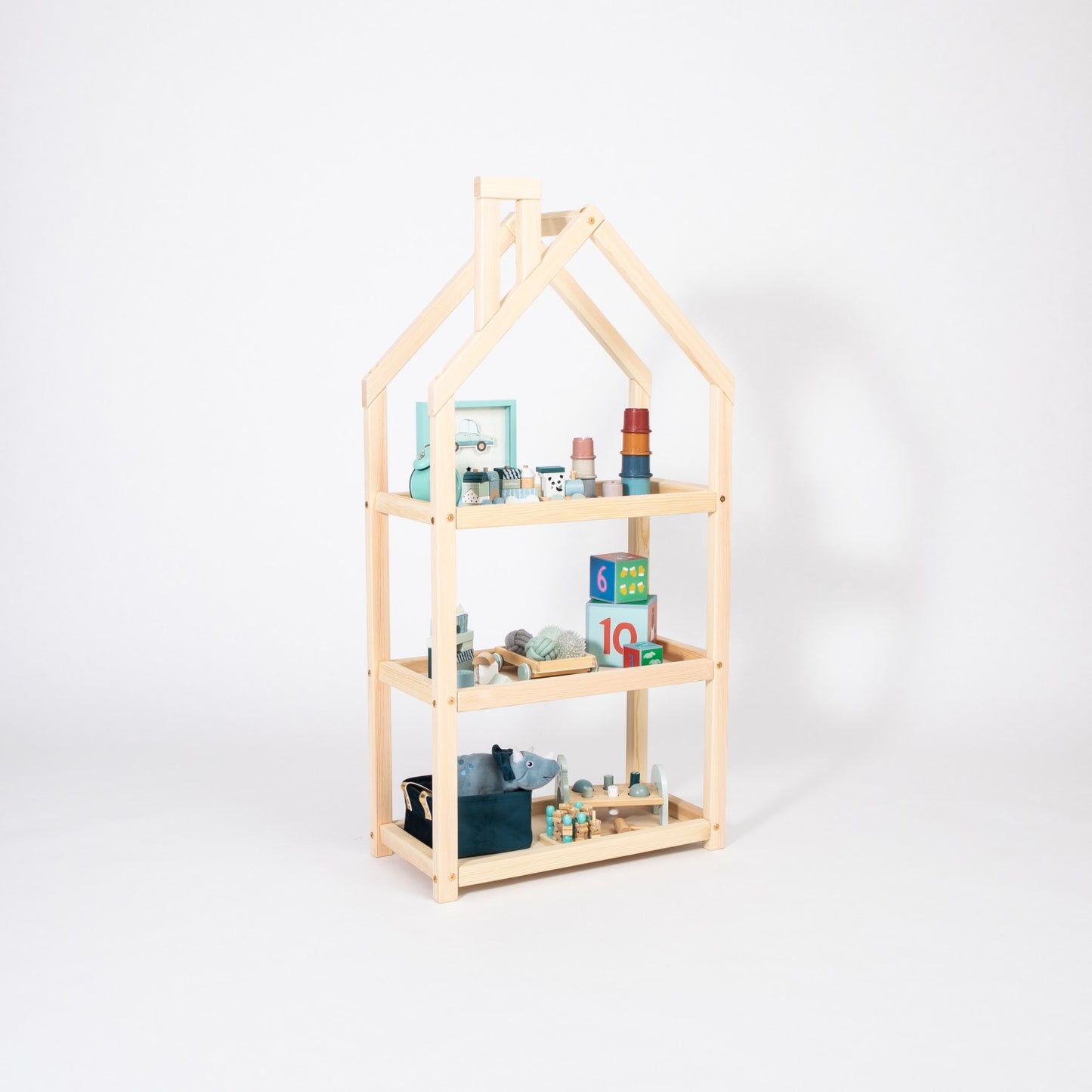 Natural birch house shelf with three shelves holding books and learning toys