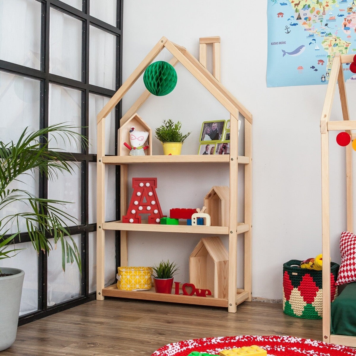 Natural wood house shelf in bedroom storing books, plants, and decorative items