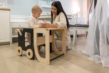 Family-scl convertible learning tower in white finish next to kitchen countertop