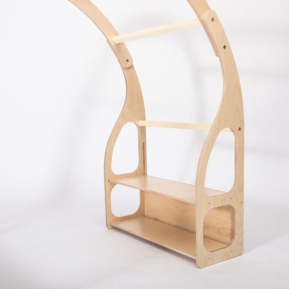 Side profile of wooden toy shelf showing three storage shelves and arched support structure