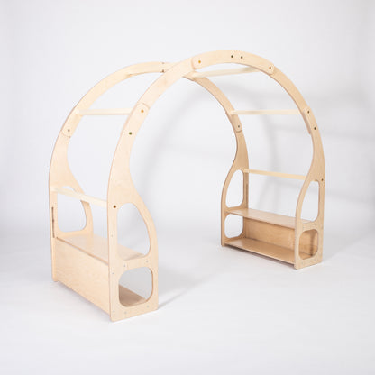 Three-quarter view showing depth of wooden Montessori toy shelf with side shelves