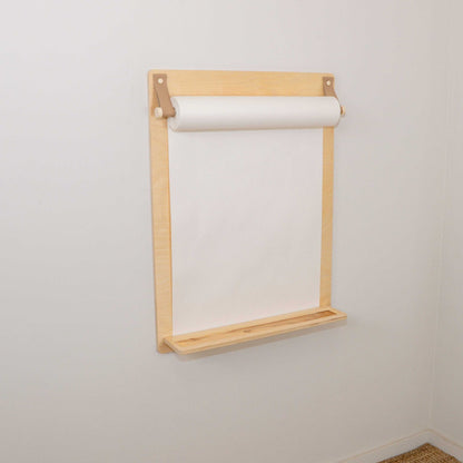 Wooden wall-mounted drawing board with built-in paper roll holder, front view