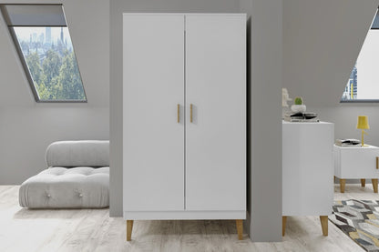 White Kubi kids wardrobe in modern bedroom with oak legs and gray upholstered bed