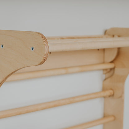 Detail of wooden peg attachment points on Pikler triangle leg