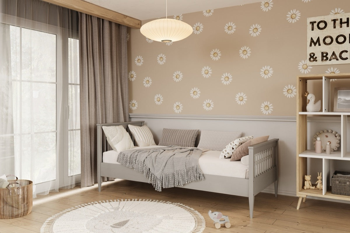 Kocot Kids Emilia white pine wood bed in modern nursery setting with natural light