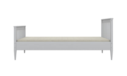 Gray Emilia toddler bed side profile showing low frame and spindle headboard