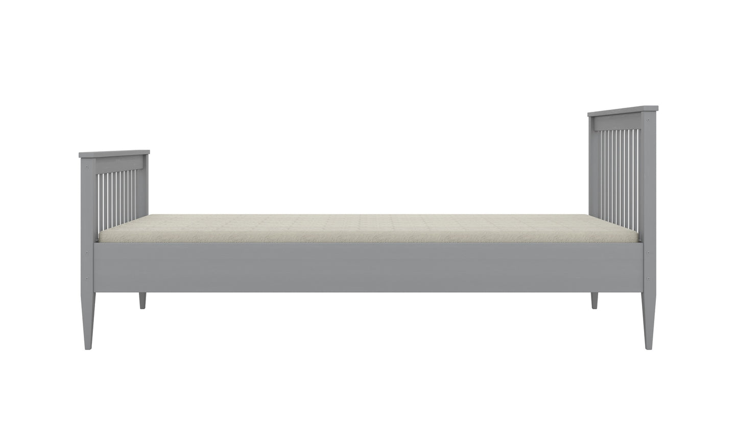 Gray Emilia wooden kids bed profile view with tapered legs and slat rails