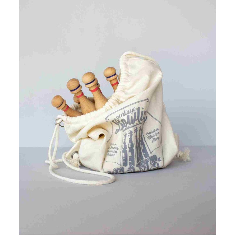 Canvas storage bag filled with wooden bowling pins and balls showing contents and drawstring closure