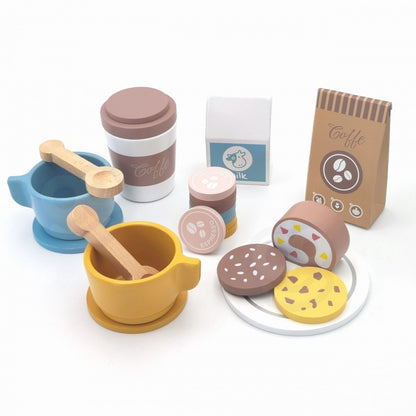 Wooden barista accessories including blue and yellow cups with handles, pastry cookies, coffee bags, and wooden stirrers