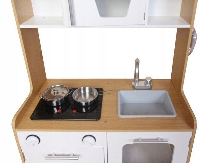 Overhead view of play kitchen showing illuminated burner with pots and sink area