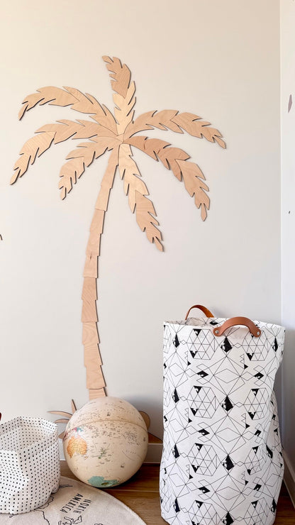 Single tall wooden palm tree wall decor with natural plywood finish in child's room