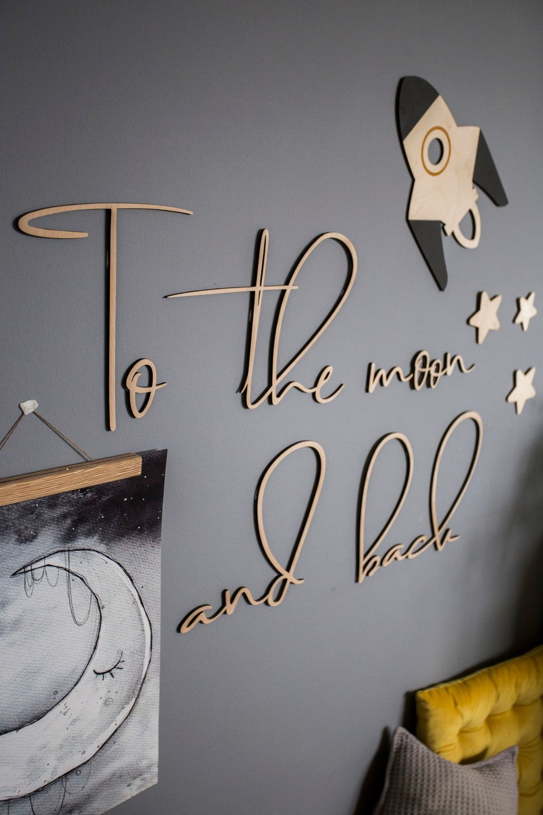 Detail view of To the Moon and Back wooden wall sign with dimensional letters and space theme